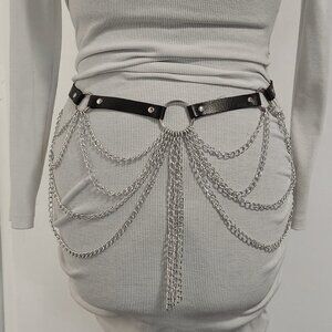 Faux leather belt with lots of chains. Fits waist or hips size 30" to 41"